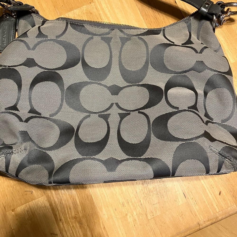 Coach SoHo Signature canvas shoulder bag with two tags.